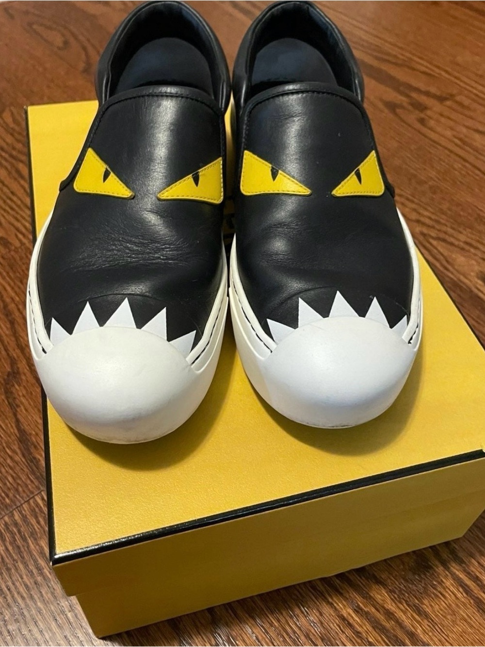 Fendi Black Leather Slip-On Sneakers with Yellow Eye Accents